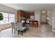 Open concept kitchen with an island featuring barstool seating and adjacent informal dining space at 2017 Bridleside Dr, Indian Trail, NC 28079