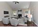Living room featuring a fireplace, comfortable seating, and a TV mounted on the wall above a console table at 2017 Bridleside Dr, Indian Trail, NC 28079