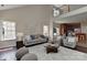 Spacious living room with two-story ceilings, large windows, and neutral decor at 2017 Bridleside Dr, Indian Trail, NC 28079