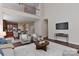 Open concept living room with a view to the kitchen and second story landing at 2017 Bridleside Dr, Indian Trail, NC 28079