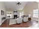 Cozy living room with a fireplace, stylish seating, and plenty of natural light creating a welcoming atmosphere at 2017 Bridleside Dr, Indian Trail, NC 28079