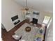 Bright living room showcasing a fireplace, ceiling fan, and lots of natural light from a large window at 2017 Bridleside Dr, Indian Trail, NC 28079
