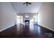 Spacious living room featuring hardwood floors, a fireplace, and ample natural light at 2017 Bridleside Dr, Indian Trail, NC 28079