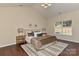 Bright and spacious bedroom with a large bed, bedside tables, and a window overlooking the backyard at 2017 Bridleside Dr, Indian Trail, NC 28079