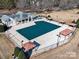 Aerial view of the neighborhood pool and clubhouse with mature landscaping surrounding the area at 2017 Bridleside Dr, Indian Trail, NC 28079