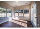Sun-drenched room featuring tile floors, large windows, and access to the backyard at 2017 Bridleside Dr, Indian Trail, NC 28079