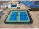 Aerial view of the community tennis courts with adjacent pool, clubhouse, and waterfront view at 2017 Bridleside Dr, Indian Trail, NC 28079