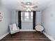 This comfy bedroom features a large window that allows ample natural light, and comfortable seating at 214 W Elm St, Wingate, NC 28174