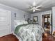 Comfortable bedroom with wood floors and a view to the dining room at 214 W Elm St, Wingate, NC 28174