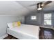 Bedroom with wood floors, light gray walls, neutral comforter, and a ceiling fan at 214 W Elm St, Wingate, NC 28174