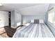 Bedroom featuring an angled wall, light gray walls and neutral bed at 214 W Elm St, Wingate, NC 28174