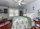 Charming bedroom with wood floors, a ceiling fan, and a floral pattern duvet at 214 W Elm St, Wingate, NC 28174