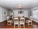 Traditional dining room with hardwood floors and a dark wood table with six chairs at 214 W Elm St, Wingate, NC 28174