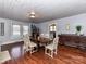 Traditional dining room with hardwood floors and a wooden table with white chairs at 214 W Elm St, Wingate, NC 28174