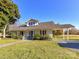 Charming home with a long, covered front porch and a matching covered carport at 214 W Elm St, Wingate, NC 28174