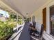 Inviting covered front porch features classic rocking chairs and views of the landscaped front yard at 214 W Elm St, Wingate, NC 28174
