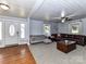 Spacious living room with hardwood floors, front entry access, and comfortable seating at 214 W Elm St, Wingate, NC 28174