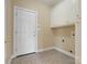 Mud room with tile flooring and lots of cabinets for storage at 2210 Pinefield Ct, Gastonia, NC 28056