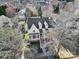 This aerial view shows a single Gathering home surrounded by trees and neighboring houses at 224 Mills Ln, Fort Mill, SC 29708