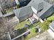 This aerial view showcases a home with a deck, backyard, white fence, and a swing set at 224 Mills Ln, Fort Mill, SC 29708