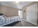 This bedroom features neutral walls, carpet, and a simple single bed with a white ceiling fan at 224 Mills Ln, Fort Mill, SC 29708