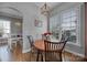 Bright breakfast nook with a round wood table, chair seating, and a large window with exterior views at 224 Mills Ln, Fort Mill, SC 29708