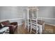 Formal dining room with a modern light fixture, hardwood floors, and neutral paint at 224 Mills Ln, Fort Mill, SC 29708