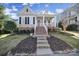 Charming single Gathering home with a welcoming porch and neatly landscaped front yard at 224 Mills Ln, Fort Mill, SC 29708
