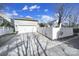 This image features a driveway leading to the garage, complemented by a white fence at 224 Mills Ln, Fort Mill, SC 29708