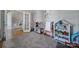 Charming playroom with a play kitchen, whiteboard, and toy storage, perfect for  at 224 Mills Ln, Fort Mill, SC 29708