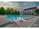 Leisure pool with splash features and a clubhouse in the background, perfect for Gathering fun at 224 Mills Ln, Fort Mill, SC 29708
