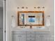 Bright bathroom with double vanity, framed mirror, updated lighting, and fresh towels at 2283 Iron Works Dr, Clover, SC 29710
