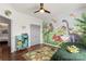 Charming bedroom features a dinosaur mural, hardwood floors, and playful decor at 2283 Iron Works Dr, Clover, SC 29710
