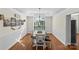 Elegant dining room with wainscoting, hardwood floors, and a chandelier at 2283 Iron Works Dr, Clover, SC 29710