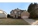 Inviting brick two-story home with a well-manicured lawn and an attached two-car garage at 2283 Iron Works Dr, Clover, SC 29710