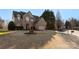 Lovely brick home with an attached two-car garage and a spacious front yard at 2283 Iron Works Dr, Clover, SC 29710