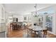 Open-concept kitchen area with a breakfast bar, eating nook, and a large window at 2283 Iron Works Dr, Clover, SC 29710