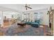 Spacious living room with hardwood floors, a fireplace, a blue sofa, and an open floor plan at 2283 Iron Works Dr, Clover, SC 29710