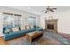Inviting living room with a stone fireplace, large windows, and a comfortable sectional sofa at 2283 Iron Works Dr, Clover, SC 29710