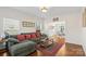Comfortable living room featuring hardwood floors, a cozy sofa, and an open doorway at 2283 Iron Works Dr, Clover, SC 29710