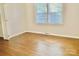 Bright bedroom featuring hardwood floors and a double window at 2314 Knickerbocker Dr, Charlotte, NC 28212