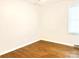 Bedroom with hardwood floors and natural light from a window at 2314 Knickerbocker Dr, Charlotte, NC 28212