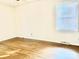 Bedroom featuring a large window and hardwood floors at 2314 Knickerbocker Dr, Charlotte, NC 28212
