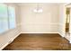 Dining area featuring hardwood floors, neutral paint, with classic lighting fixtures at 2314 Knickerbocker Dr, Charlotte, NC 28212
