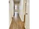 Hallway view showcasing hardwood floors and access to multiple rooms at 2314 Knickerbocker Dr, Charlotte, NC 28212
