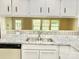 Bright and airy kitchen with modern countertops, stainless steel sink, and a stylish backsplash at 2314 Knickerbocker Dr, Charlotte, NC 28212