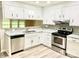 Well-lit kitchen featuring stainless steel appliances, sleek countertops, and ample cabinetry at 2314 Knickerbocker Dr, Charlotte, NC 28212