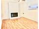 Comfortable living room with a brick fireplace and classic hardwood floors at 2314 Knickerbocker Dr, Charlotte, NC 28212