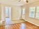Open concept living room featuring hardwood floors and plenty of natural light at 2314 Knickerbocker Dr, Charlotte, NC 28212