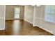 Bright living room featuring hardwood floors and natural light from large windows at 2314 Knickerbocker Dr, Charlotte, NC 28212